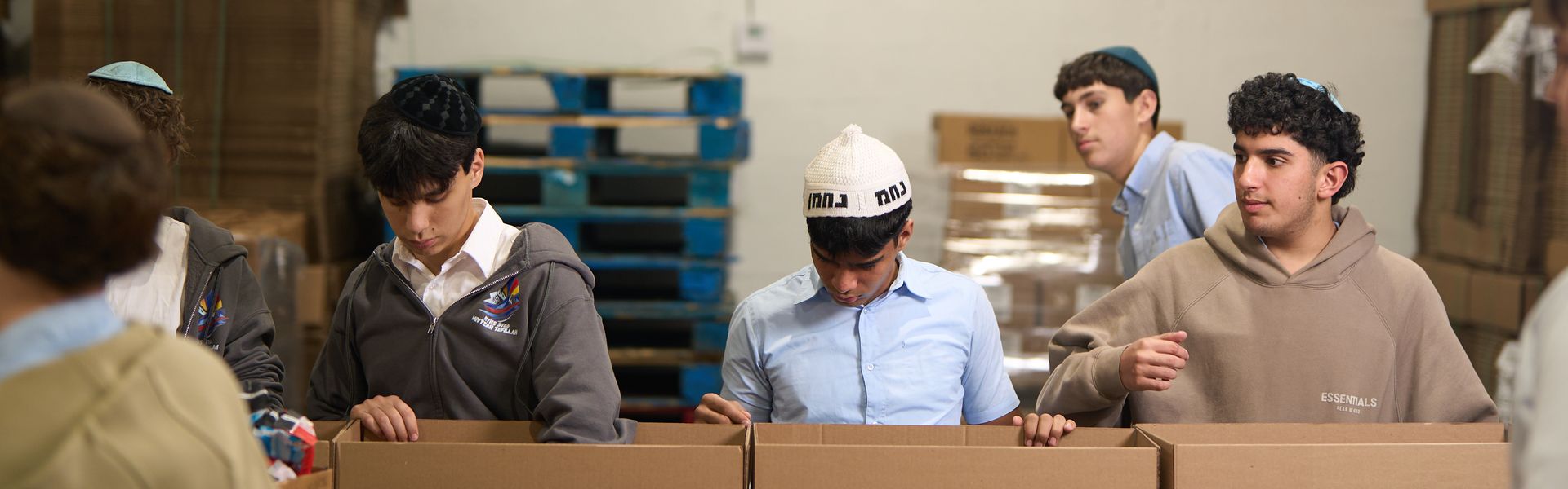 Tomchei Shabbos volunteers packing boxes
